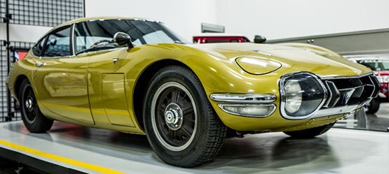 angled view of gold Toyota 2000GT