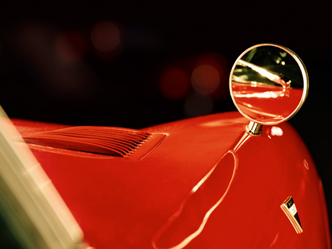 zoomed view of front of Toyota 2000GT car mirror