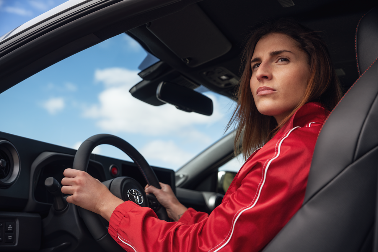 Woman driving Toyota