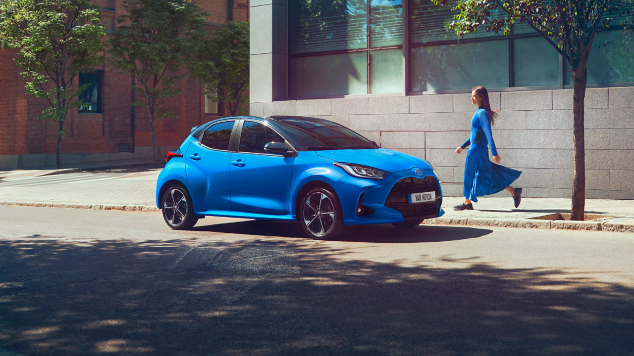 Toyota Yaris Hybrid blue parked on street