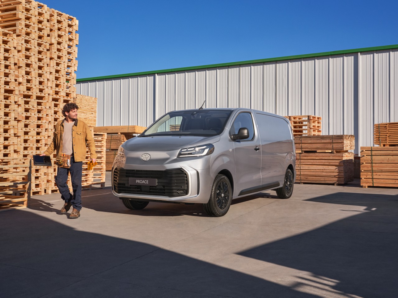 Toyota Proace surrounded by pallets and a workman